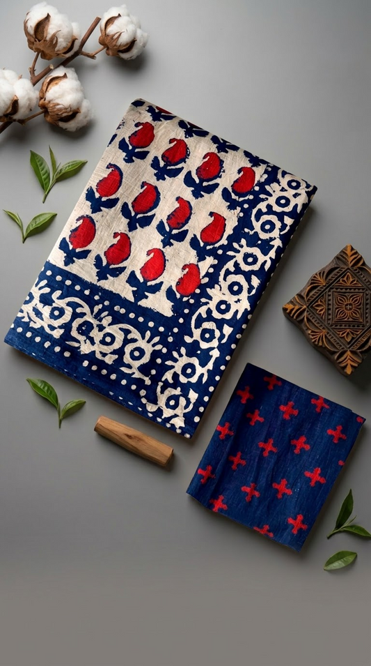 Ivory red bud print cotton saree with its navy floral border and navy red-cross blouse piece arranged in an artisan flat lay