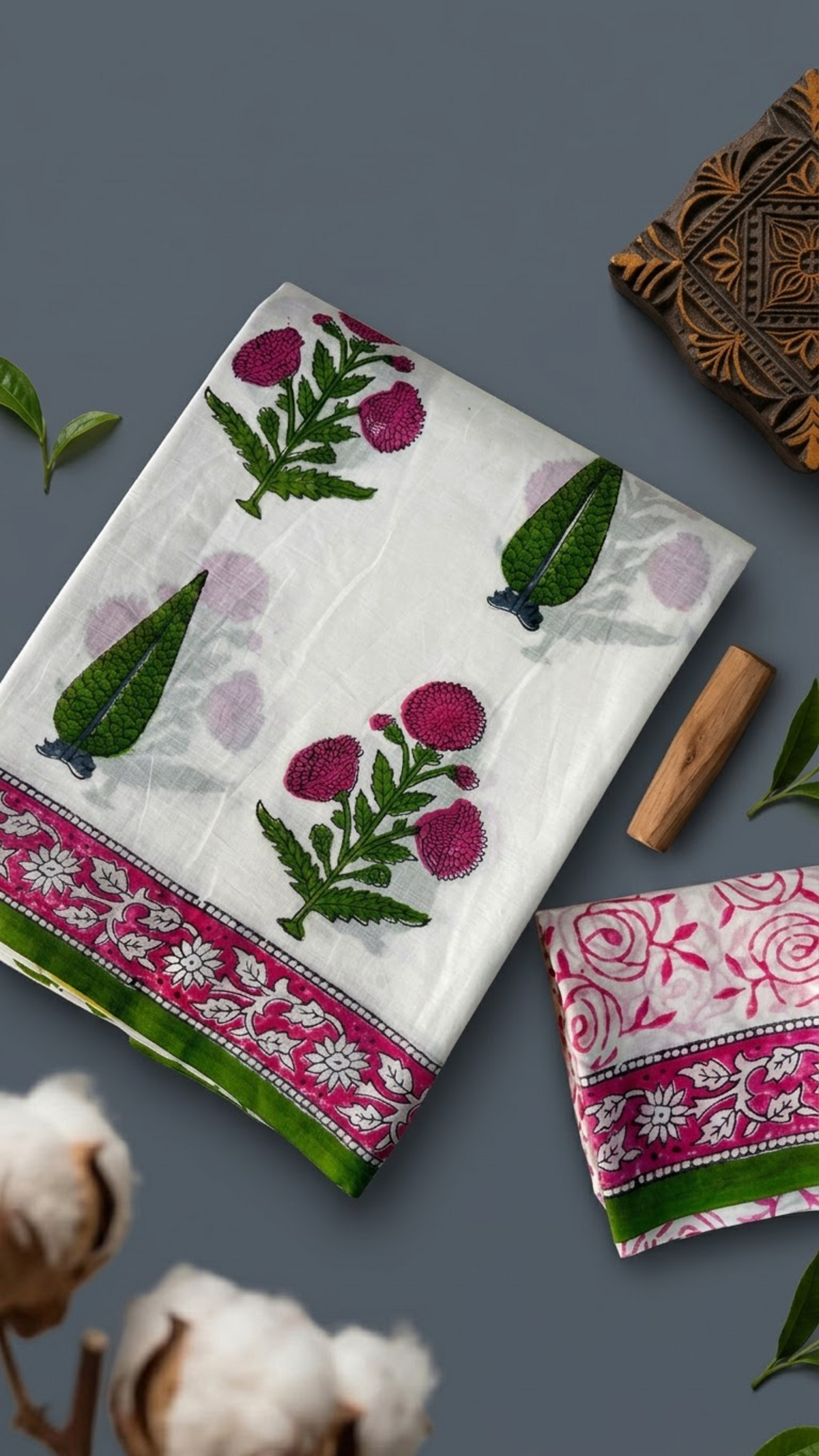 Ivory cotton saree with pink blossoms, green leafy sprigs, pink border, and ivory pink floral blouse piece, shown with the blouse piece in a close detail view