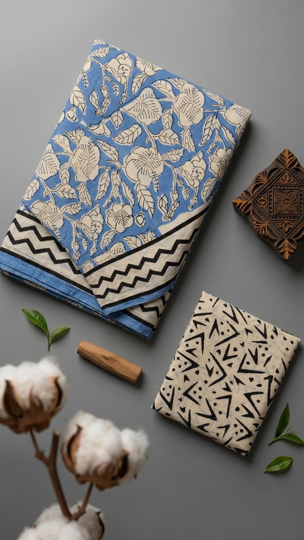 Blue cotton saree with ivory botanical print, black chevron border, and ivory geometric blouse piece, shown with the blouse piece in a close detail view