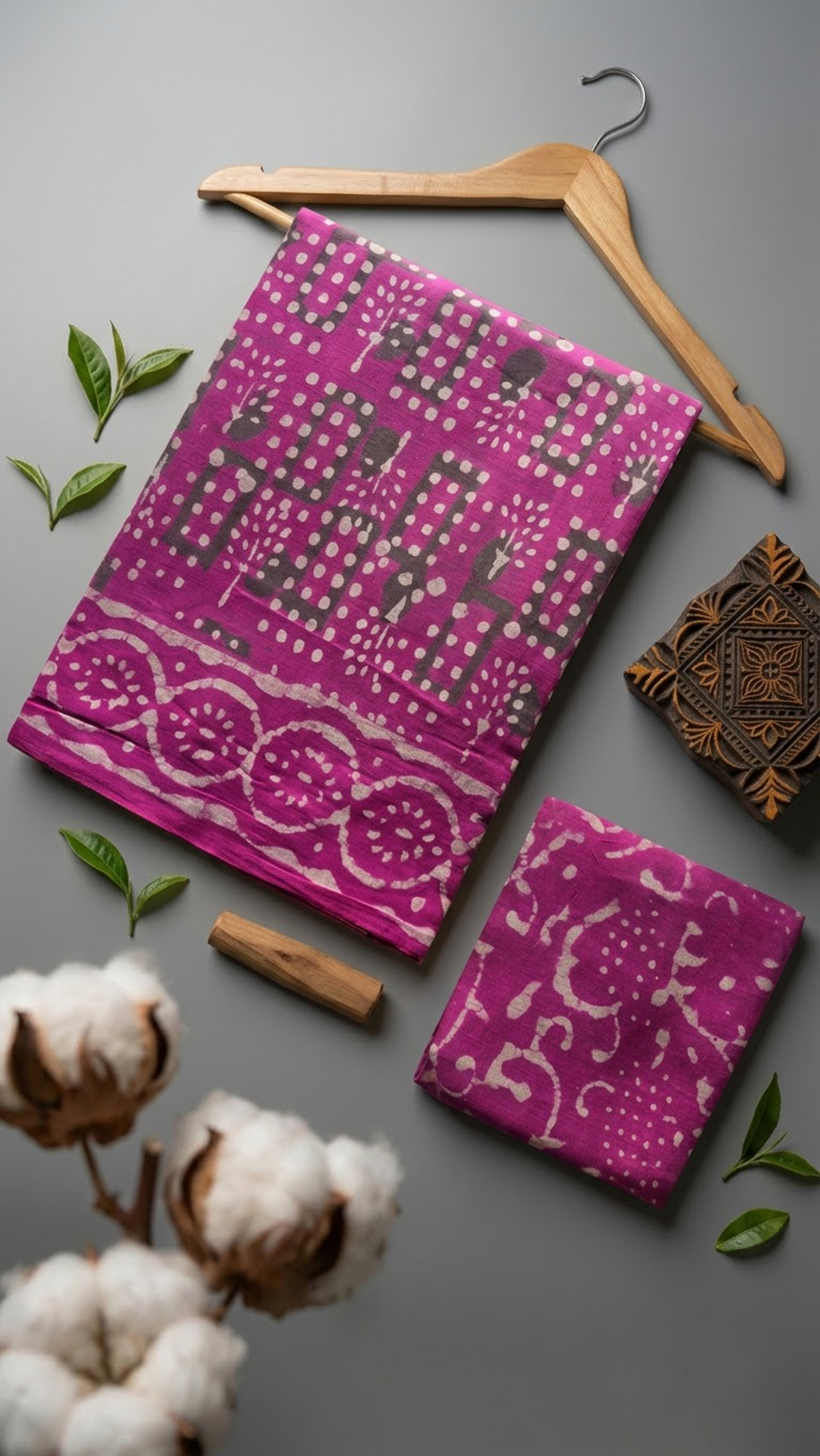 Flat lay of magenta geometric print cotton saree with coordinating blouse piece