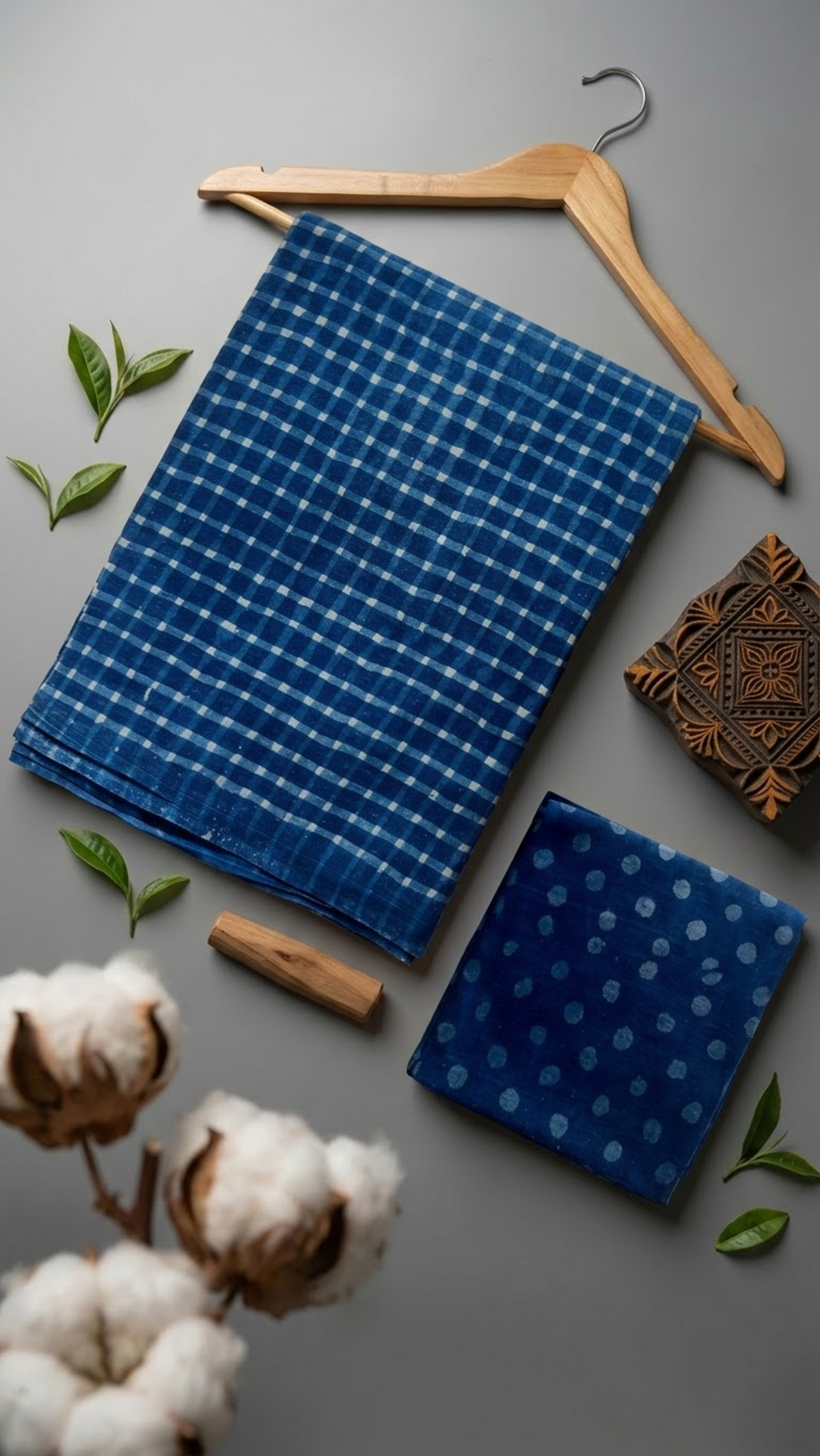 Flat lay of blue check cotton saree with coordinating blouse piece