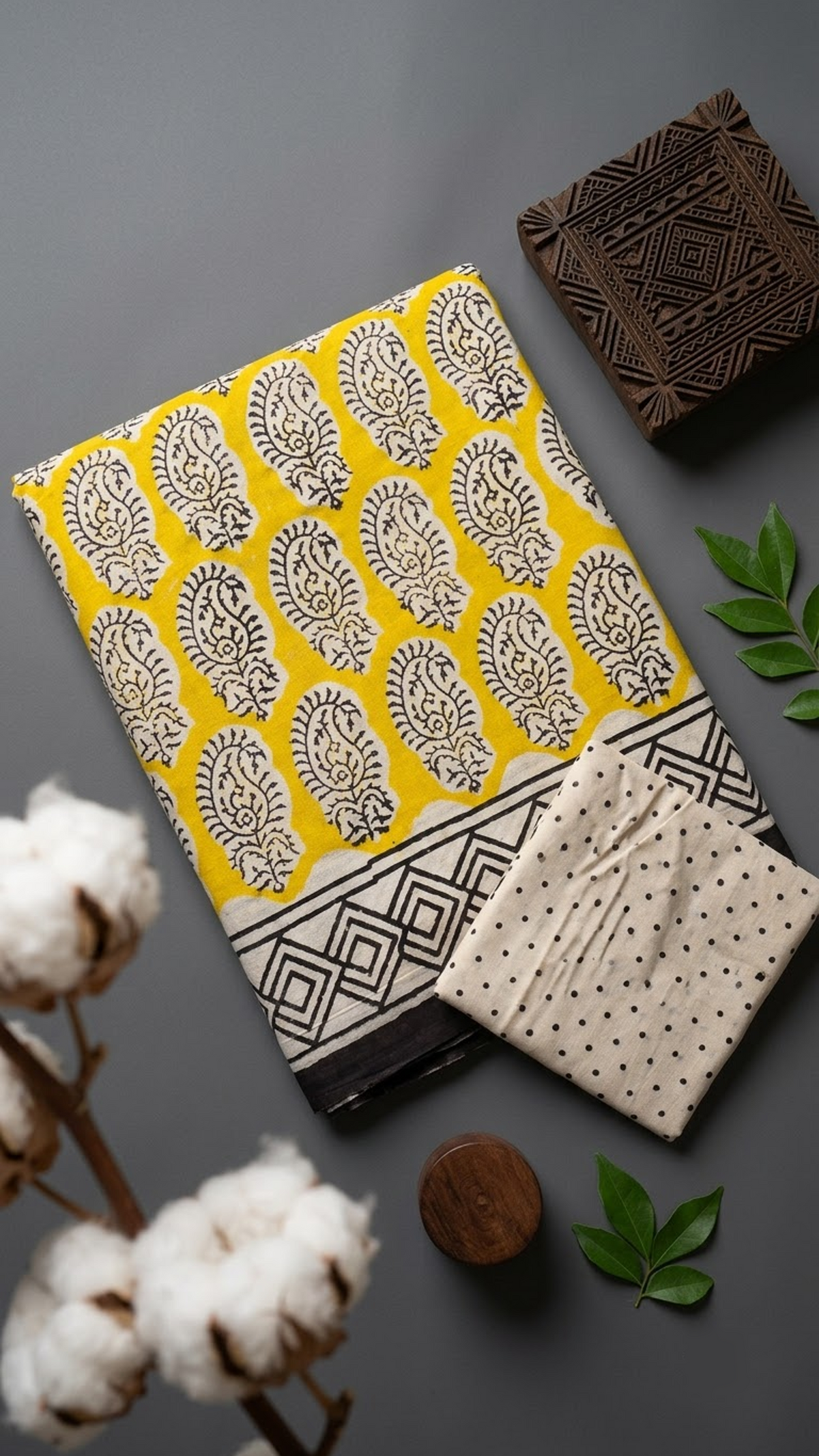 Detail of yellow paisley motif cotton saree print and blouse piece