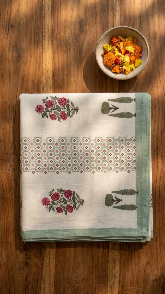Rose Bouquet & Sage Trellis Block Print Cotton Bedsheet Set folded, showing rose bouquet and cypress topiary motifs with hexagon border